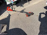 Full view of Black & Decker Edge Hog edger showing handle, shaft, wheels