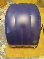 Top view of blue inflatable lounger showing three main air chambers