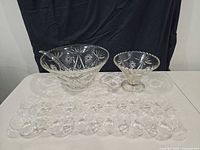 Entire punch set laid out showing punch bowl, compote, ladle and cups