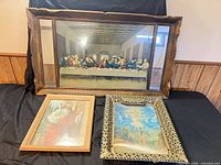 Three framed prints: Last Supper, Ascension, Jesus with staff
