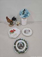 All items group shot showing plates, rooster figurine, creamer, vase with flowers