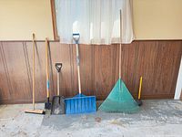 All six tools standing against wall