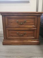Front view of one nightstand showing drawers and hardware