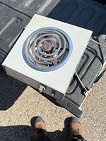 Angled view of Superior single-burner hot plate showing overall condition and attached cord