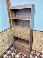 Full front view of bookcase showing shelves, drop-front desk, and lower cabinet