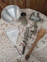 all components of the tomato grinder laid out