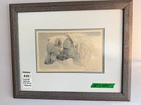 Full view of framed Robert Bateman limited edition wolves print showing frame, mat, edition label and dimensions tape