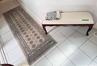 Bench, runner rug, folded throw