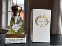 Bottle seated in open box showing level and branding