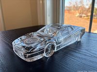 Front side view of clear crystal Ferrari Testarossa model on table