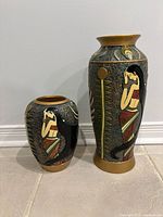 Front view of both vases with Egyptian woman design visible