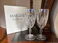 Pair of crystal iced beverage glasses beside original box