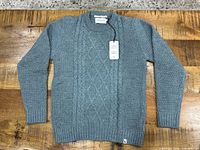 Front view of seafoam Peregrine Picton Jumper sweater with tags attached