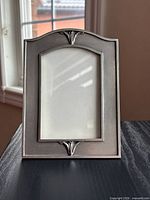 Front view of pewter frame showing design and opening