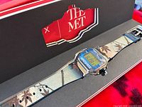 Watch in open branded box showing dial and strap