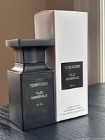 Front view of bottle and box showing branding and size