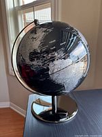 Full view of globe showing continents and metal meridian