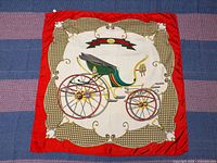 Full view of red Gucci silk scarf showing coach carriage design