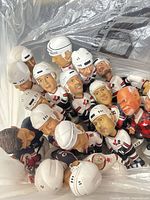 Group of Team Canada bobbleheads in plastic bag