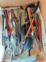 Top view of box showing mixed utensils