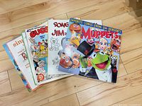 Front view of six featured album covers including Muppets and Bugs Bunny
