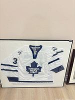 Full view of framed signed jersey