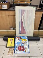 Group view of all framed prints, plaque and tube