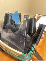 Clear acrylic shield panel, black seat parts, green plastic base