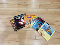 Front covers of eight sample records including Fraggle Rock, Ghostbusters, Winnie the Pooh, Pinocchio, Rocky, others
