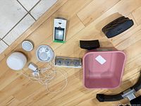 group shot showing all items: iHome speaker, smart speaker, alarm clock, night light, weather station, storage bin, power adapter and cables