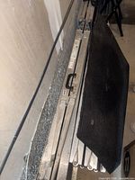 Folded aluminum ramp with black pad and carry handle