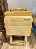 front view of nested TV trays on stand