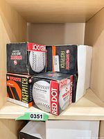 Shelf view showing several Worth Red Dot K-Master softball boxes