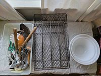 Bowls, organizer tray, plastic bin and some utensils visible