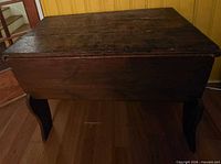 Closed dough box front view showing lid and legs