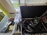 Plastic tote with multiple cassette players, headphones, accessories