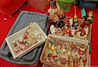Overall view of trays and boxes filled with assorted ornaments and figurines
