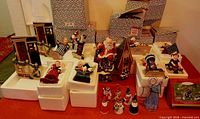 Group view of all Hallmark figurines and ornament with several original boxes