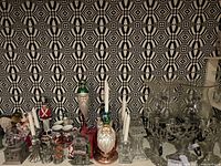 Full shelf view showing range of Santa, crystal, pewter and glass items