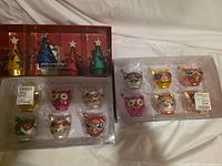 Both boxed sets showing all items