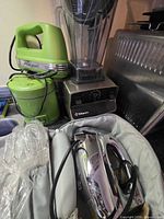 Group showing Vitamix blender, Cuisinart mixer, Wolfgang grinder, chrome mixer in case