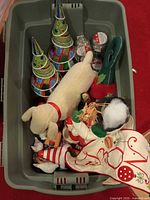 Overall bin showing multiple Christmas decor items