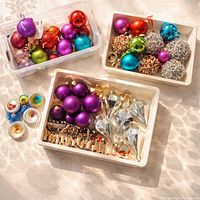 Tray of multicoloured balls, wire-beaded balls and spiral discs