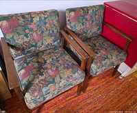 Both armchairs side by side showing overall design, upholstery pattern and wood frames