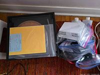 Top view of VPI machine with documents on lid and bagged accessories adjacent