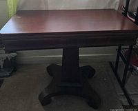 Full view of table with leaves down, showing pedestal base