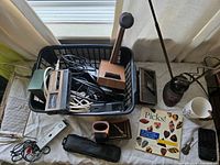 Overall lot in basket showing cassette player, microphone, cables