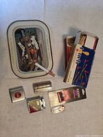 Lot overview showing tray, matchbox, lighters, Zippo wick, flint dispenser