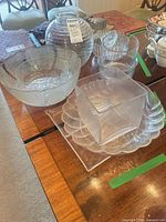 Group shot showing large bowl, ribbed vase, nesting bowls, and platter