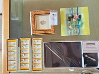 Lot overview showing glass plate, framed art, three boxes of place-card holders, Celebrate It set